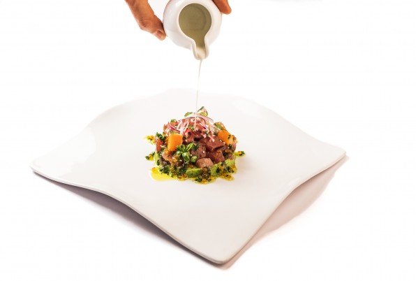 Nikei tuna tartar, avocado emulsion, sweet potato, sesame and coconut cream with tiger milk.