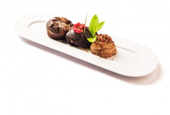 Chocolate madness, guanaja hot chocolate coulant, Belgian chocolate ice cream on cocoa ground, nutella foam and explosive textures.