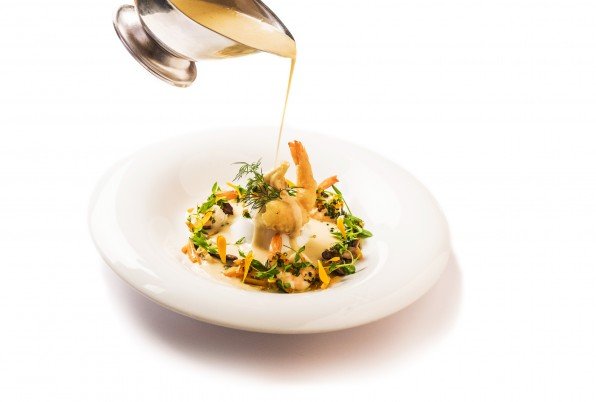 Coconut soup infused with lemon grass, lobster, shrimp, carrot emulsion, cultivated mushrooms, coriander and crunchy chocolates.